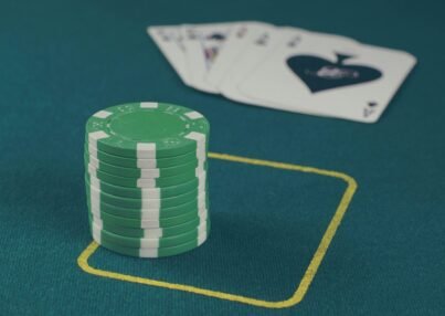 green poker chips on